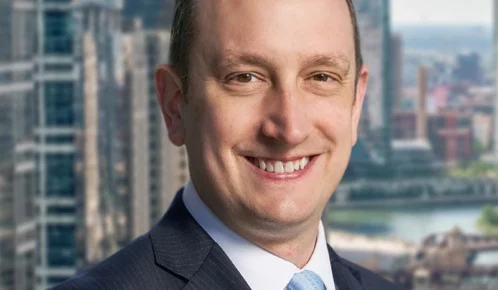 Ankin Law Workers' Compensation attorney Josh Rudolfi closeup in a business suit.